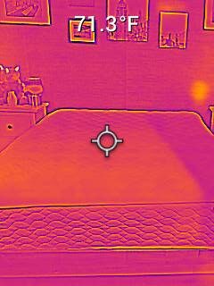 Nichole testing the surface temperature on the WinkBeds EcoCloud Hybrid Mattress