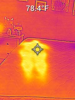 Nichole testing the body temperature on the WinkBeds EcoCloud Hybrid Mattress