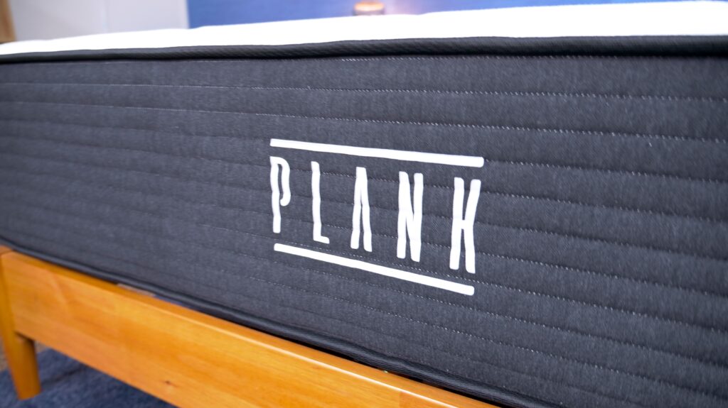A closeup of the Plank logo on the Plank Firm mattress.