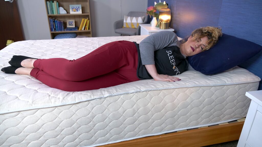 Nichole side sleeping on the WinkBeds EcoCloud Hybrid Mattress