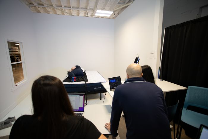 Our testers using a special mat to generate pressure maps