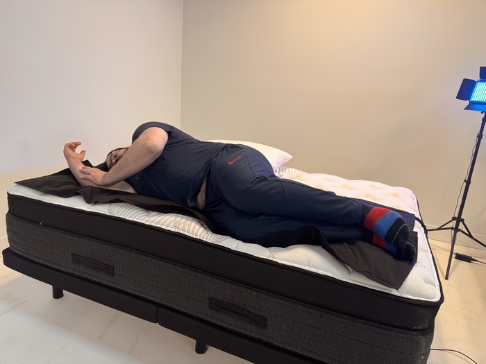 A man lying on his side on the Nolah Evolution mattress.