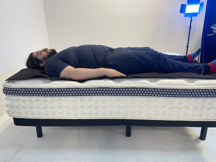 A man lying on the WinkBed on his back.