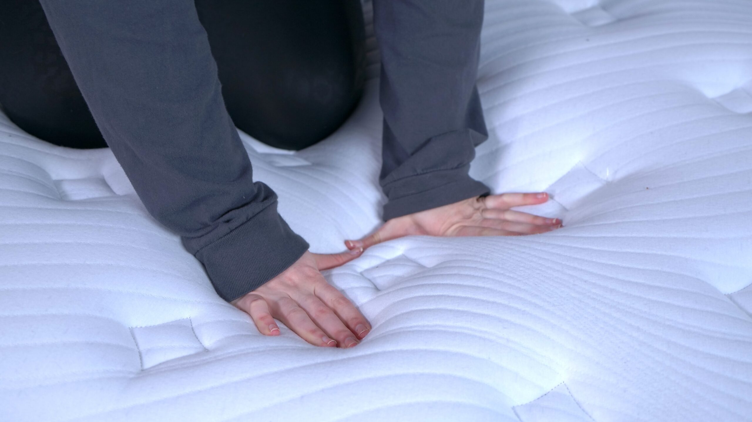 Nichole touching the cover of the Bear Elite Hybrid